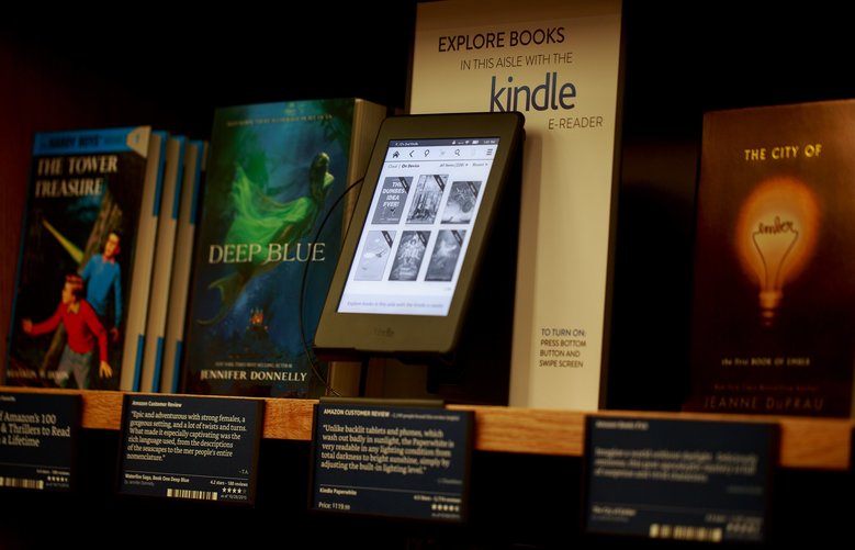 Amazon Books offers Kindles, e-book readers, throughout the store to provide more information on books offered in the store's isles. Amazon Books, the company's first brick-and-mortar store, will open tomorrow Tuesday, Nov. 3, 2015 in Seattle's University District.